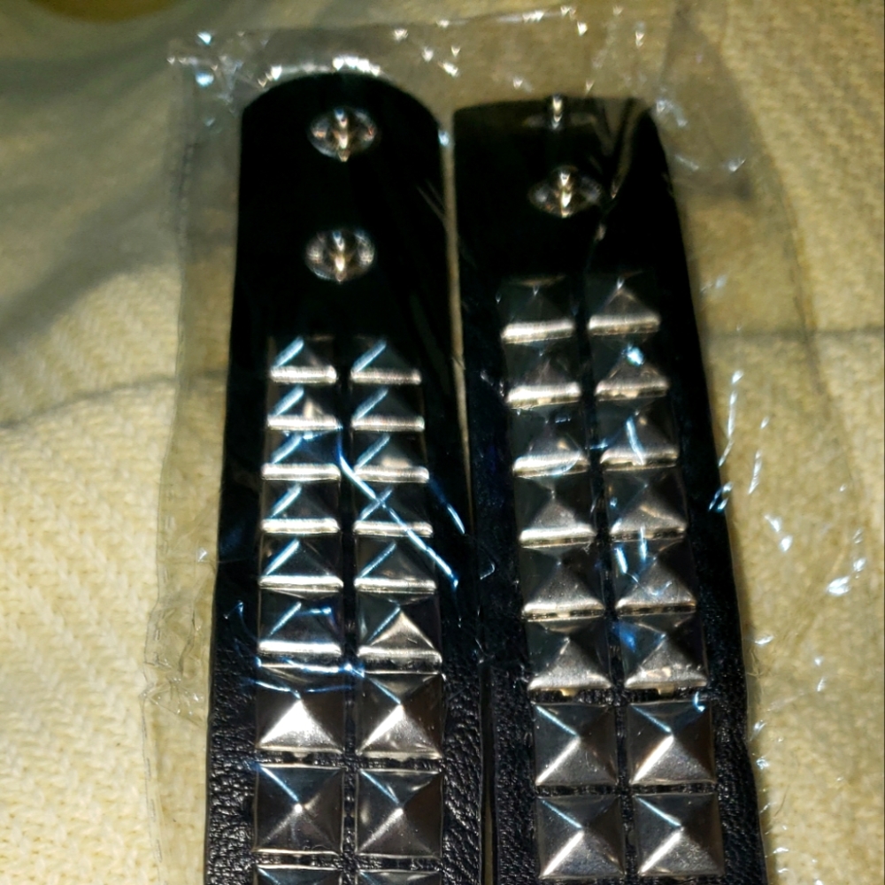 Brand new without tags unisex black leather studded wrist bands.